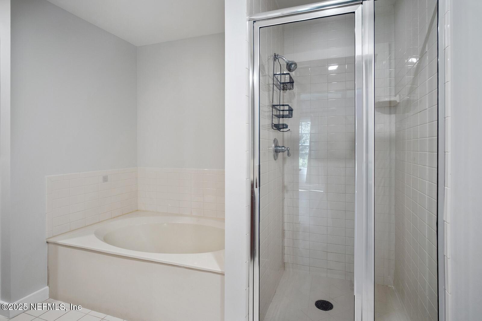 945 Registry Boulevard, Unit 210 St. Augustine, FL 32092 - Photo 14 of 28 a bath room with a shower and a sink