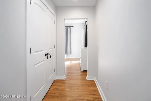 a view of a bathroom from a hallway