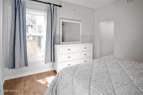 a view of balcony with wooden floor