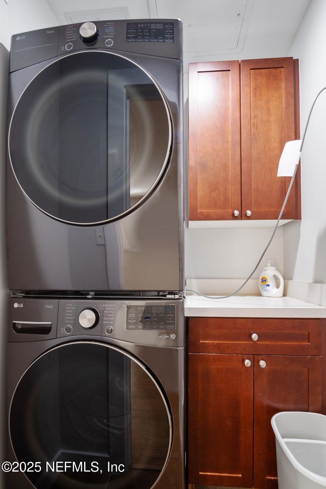 945 Registry Boulevard, Unit 210 St. Augustine, FL 32092 - Photo 27 of 28 a utility room with mirror washer and dryer