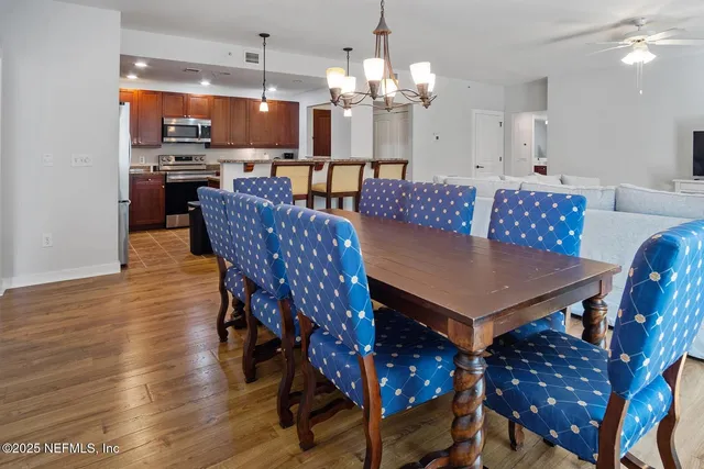 a view of a dining room with furniture and wooden floor