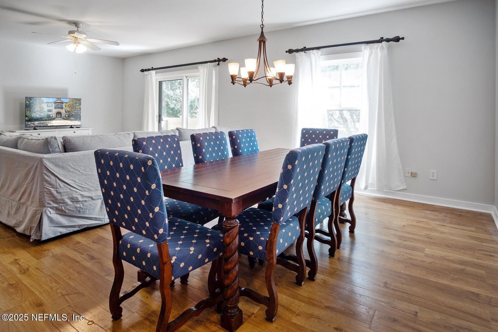945 Registry Boulevard, Unit 210 St. Augustine, FL 32092 - Photo 10 of 28 a view of a dining room with furniture window and wooden floor