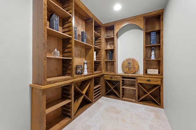 a view of utility room with racks on the wall