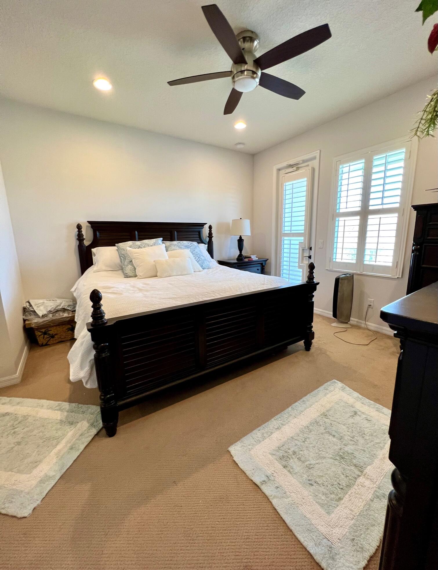 1346 Turnbridge Drive Jupiter, FL 33458 - Photo 20 of 46 a bed room with a bed window and a couch