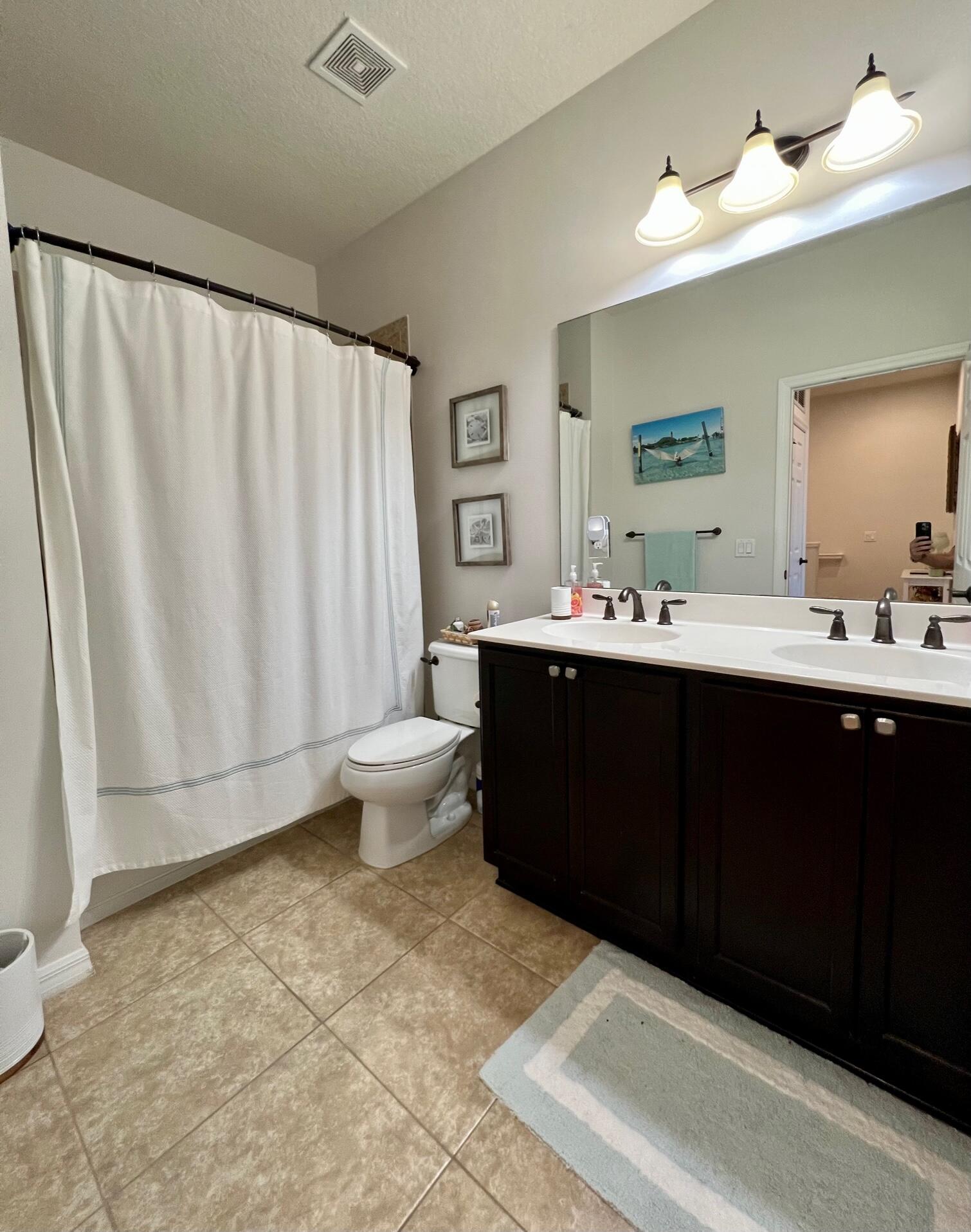 1346 Turnbridge Drive Jupiter, FL 33458 - Photo 22 of 46 a bathroom with a sink and a mirror