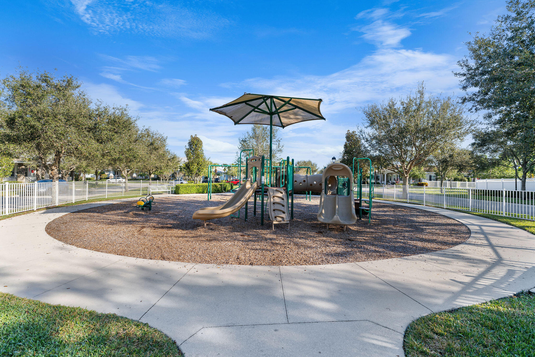 1346 Turnbridge Drive Jupiter, FL 33458 - Photo 27 of 46 a backyard of a house with table and chairs