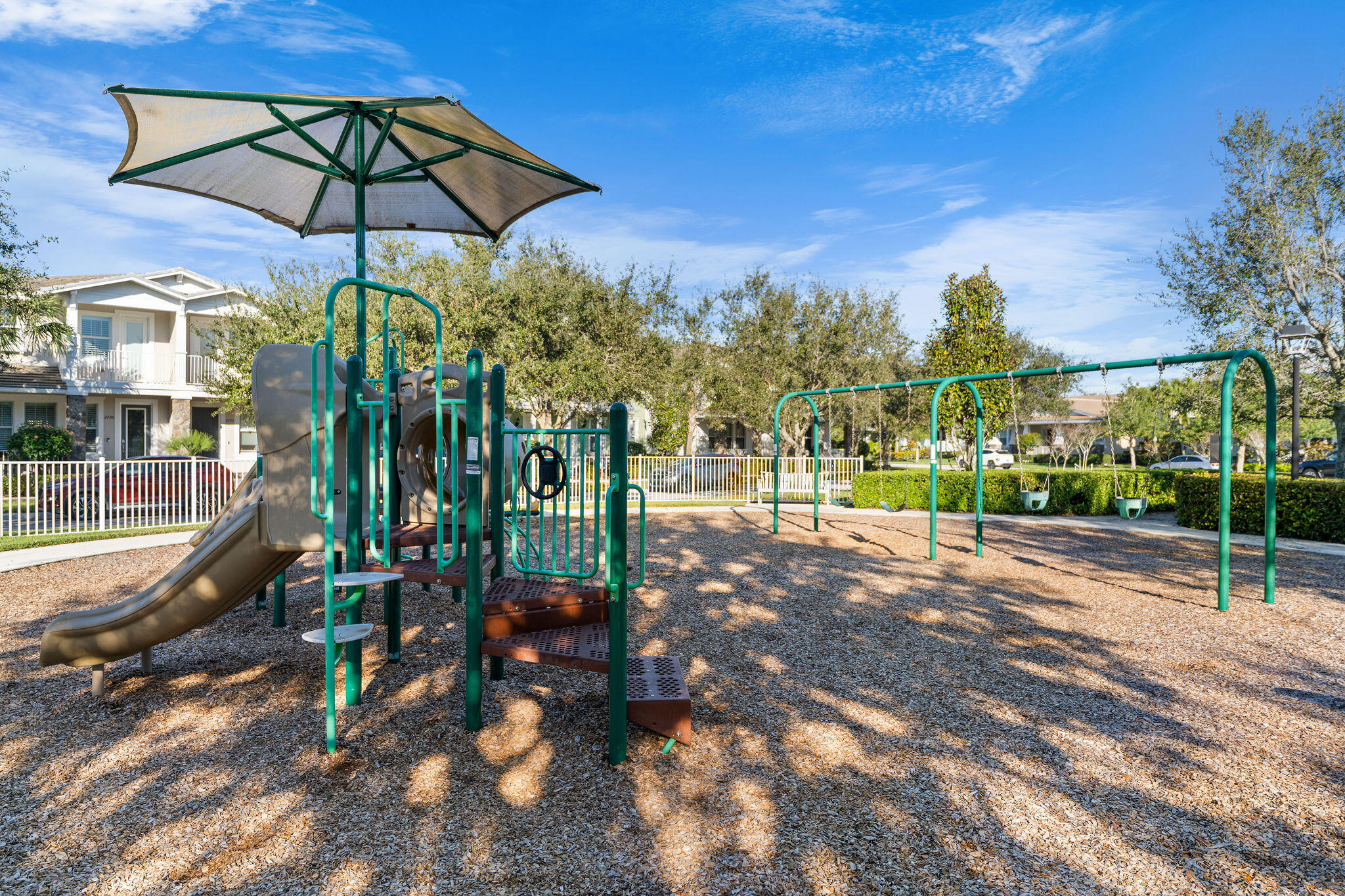 1346 Turnbridge Drive Jupiter, FL 33458 - Photo 28 of 46 a view of a park with swings and slides