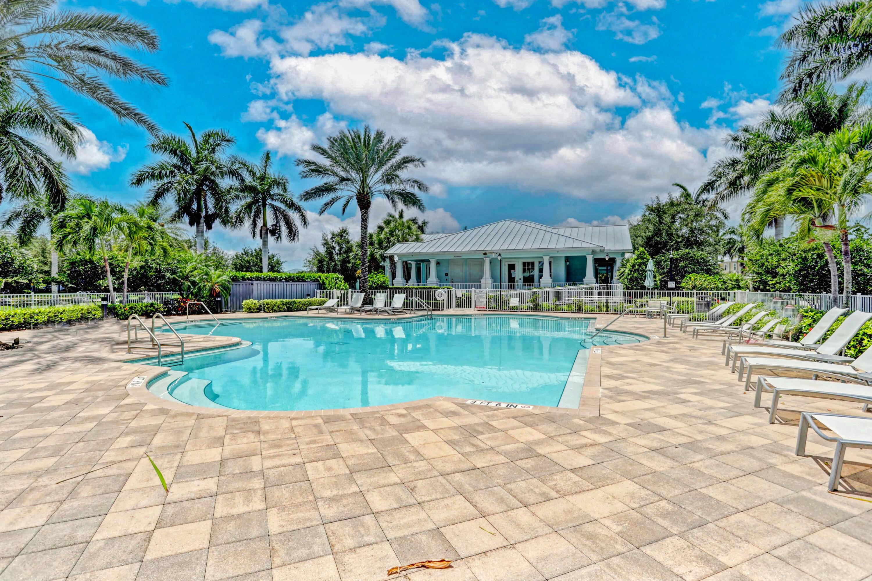 1346 Turnbridge Drive Jupiter, FL 33458 - Photo 32 of 46 a view of a swimming pool and a yard