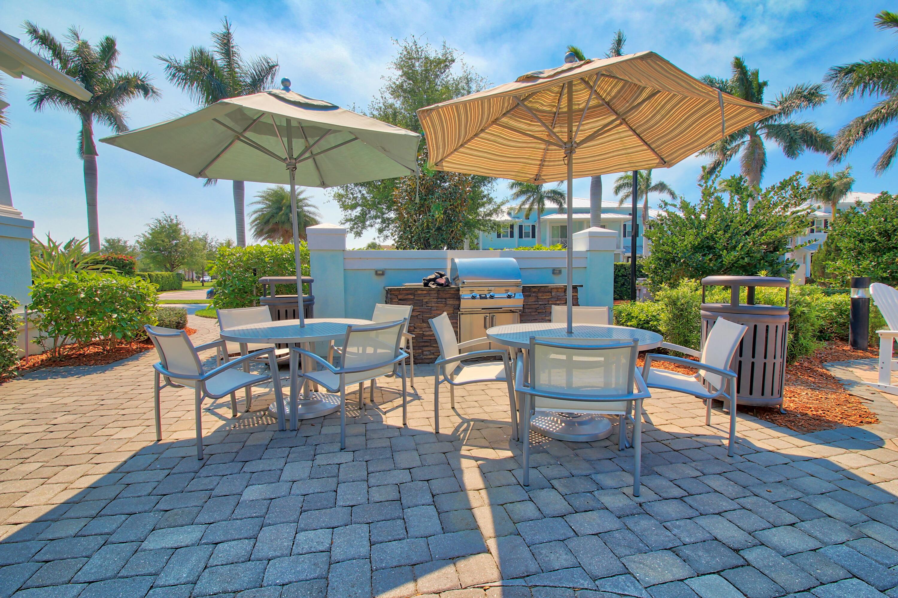 1346 Turnbridge Drive Jupiter, FL 33458 - Photo 37 of 46 a view of a backyard with sitting area