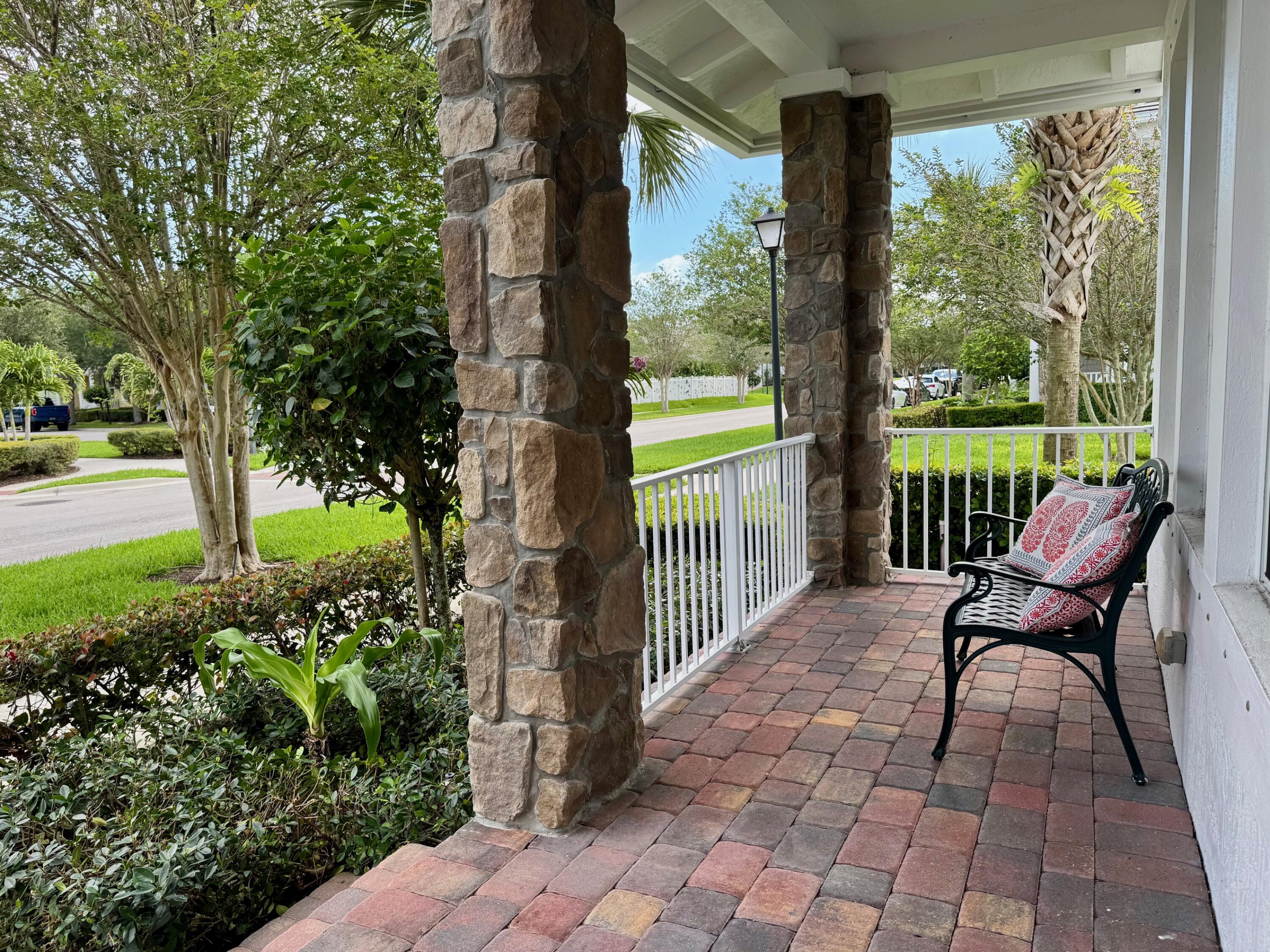 1346 Turnbridge Drive Jupiter, FL 33458 - Photo 5 of 46 a view of a porch with furniture and a yard