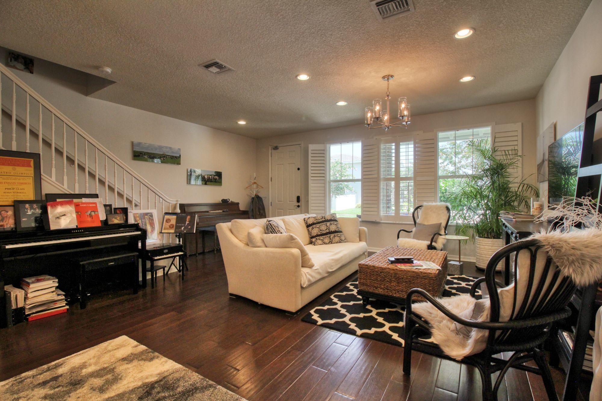 1346 Turnbridge Drive Jupiter, FL 33458 - Photo 7 of 46 a living room with furniture and a wooden floor