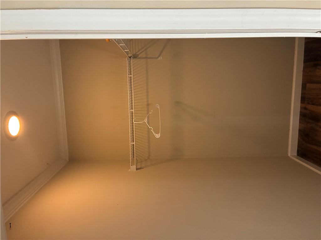 125 Ricks Road Fair Play, SC 29643 - Photo 12 of 23 Crown molding frames the ceiling above integrated wire shelving in this functional storage space.