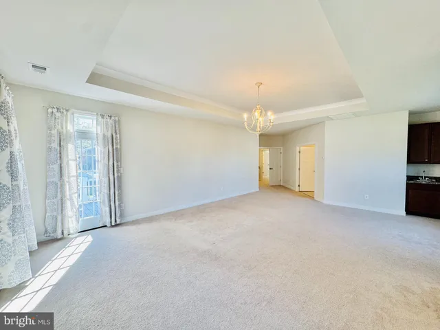 a spacious bathroom with a tub sink shower and mirror