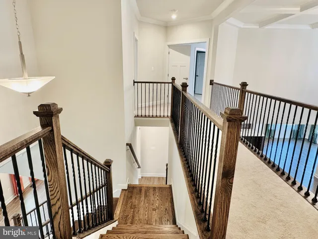 an empty room with closet and a chandelier fan