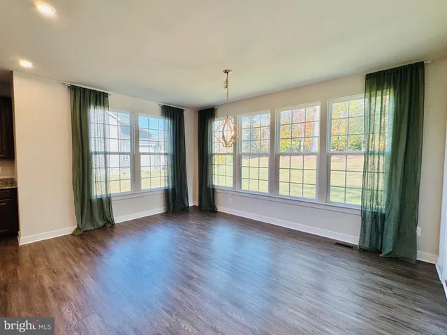 a view of a house with swimming pool and a yard