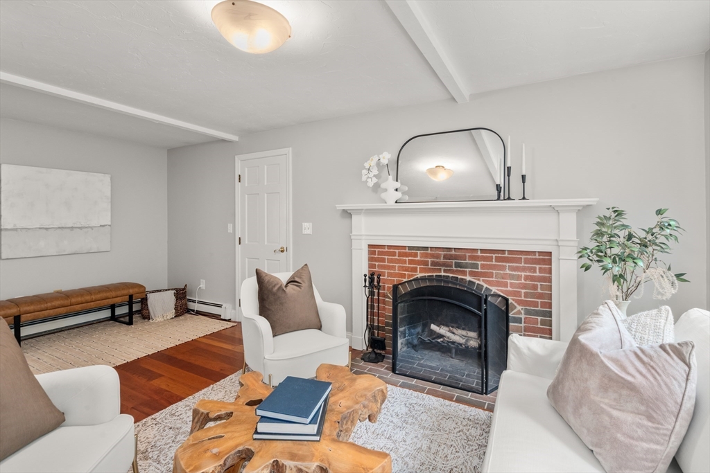 11 East Evergreen Road Natick, MA 01760 - Photo 11 of 30 a living room with furniture and a fireplace