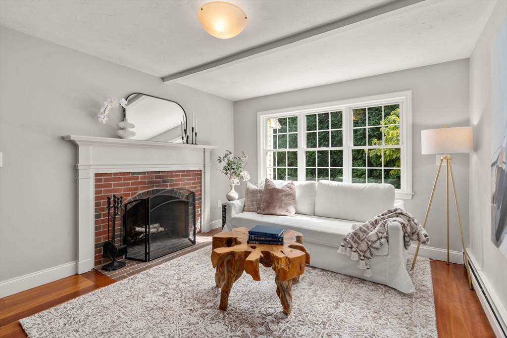 11 East Evergreen Road Natick, MA 01760 - Photo 12 of 30 a living room with furniture and a fireplace