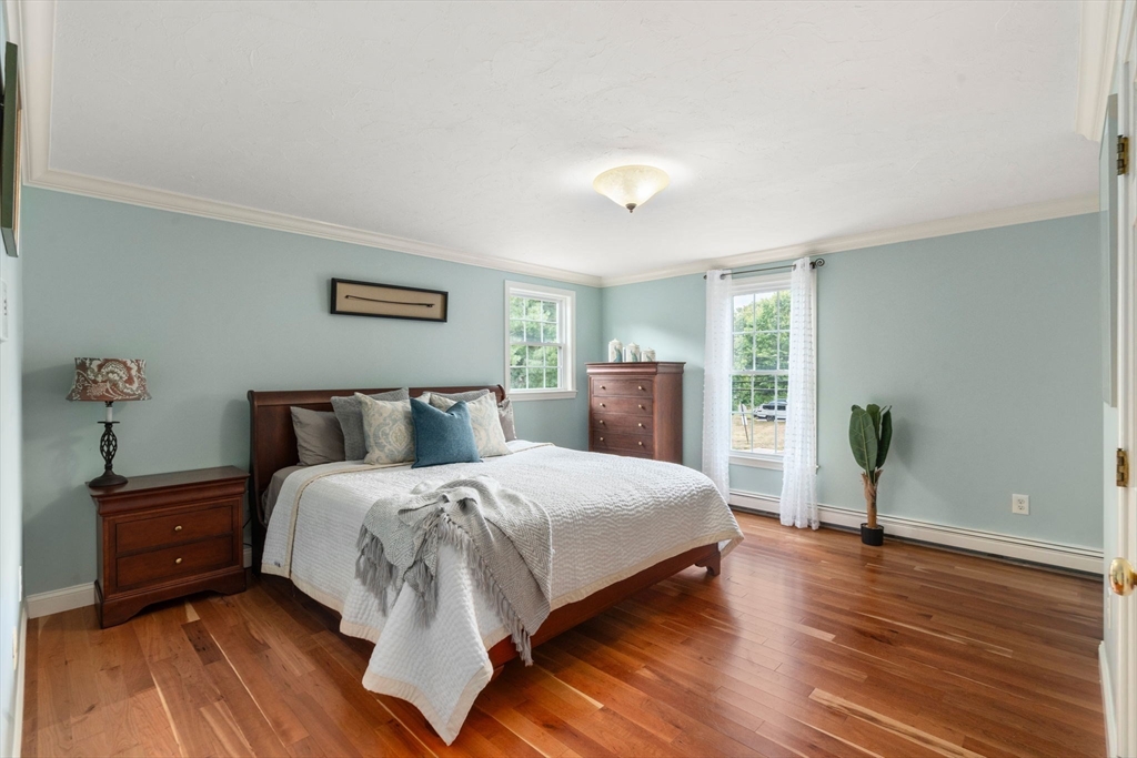 11 East Evergreen Road Natick, MA 01760 - Photo 14 of 30 a bedroom with a bed and wooden floor