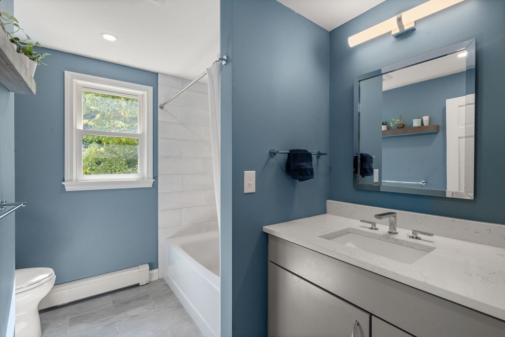11 East Evergreen Road Natick, MA 01760 - Photo 20 of 30 a bathroom with a sink a toilet and shower