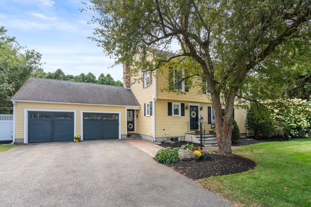 11 East Evergreen Road Natick, MA 01760 - Photo 24 of 30 a front view of a house with garden