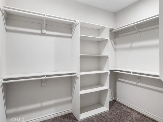 a view of an empty walk in closet