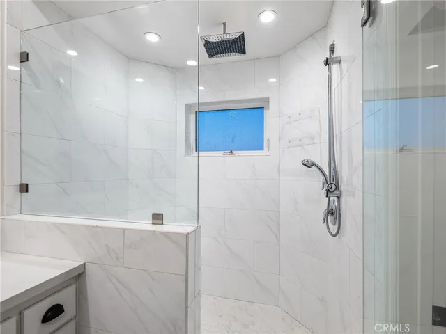 a bathroom with a shower and a tub