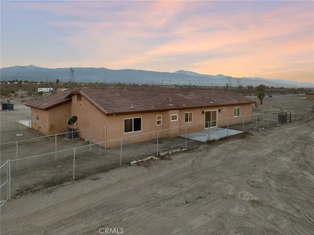 a house view with a backyard space