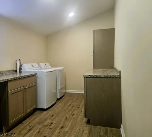 a utility room with a sink washer and dryer