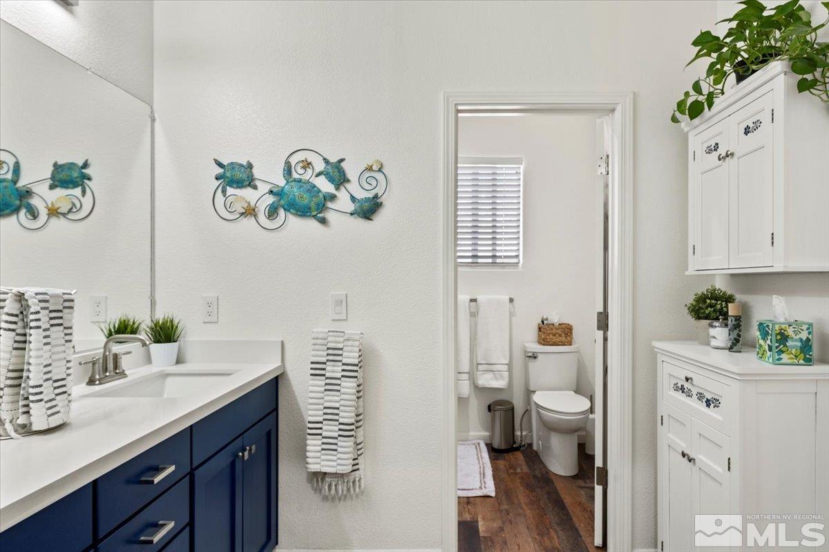 2151 Brittany Meadows Drive Reno, NV 89521 - Photo 18 of 40 a view of bathroom with a toilet sink and mirror