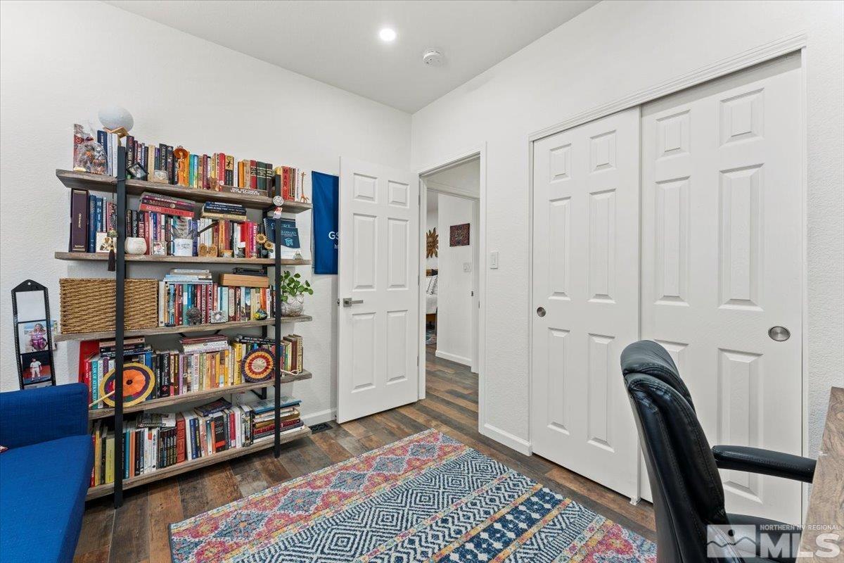 2151 Brittany Meadows Drive Reno, NV 89521 - Photo 22 of 40 a livingroom with a book shelf
