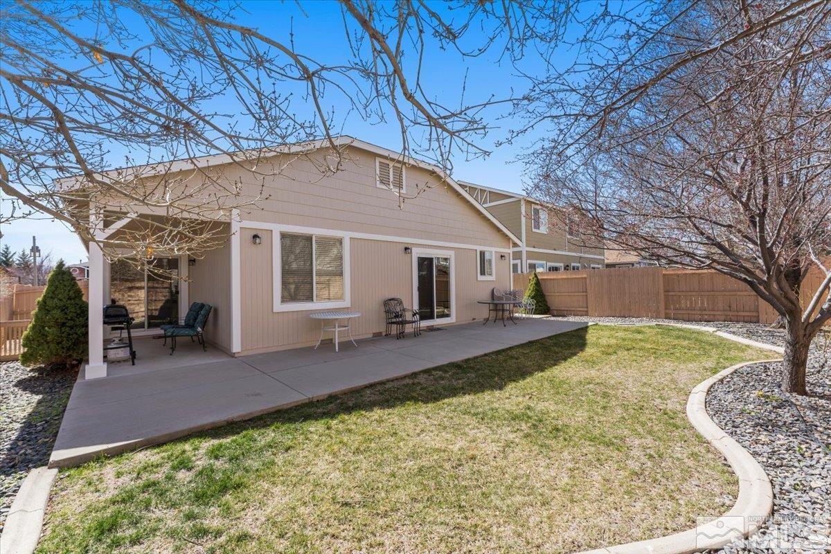 2151 Brittany Meadows Drive Reno, NV 89521 - Photo 28 of 40 a view of a house with a yard patio and fire pit