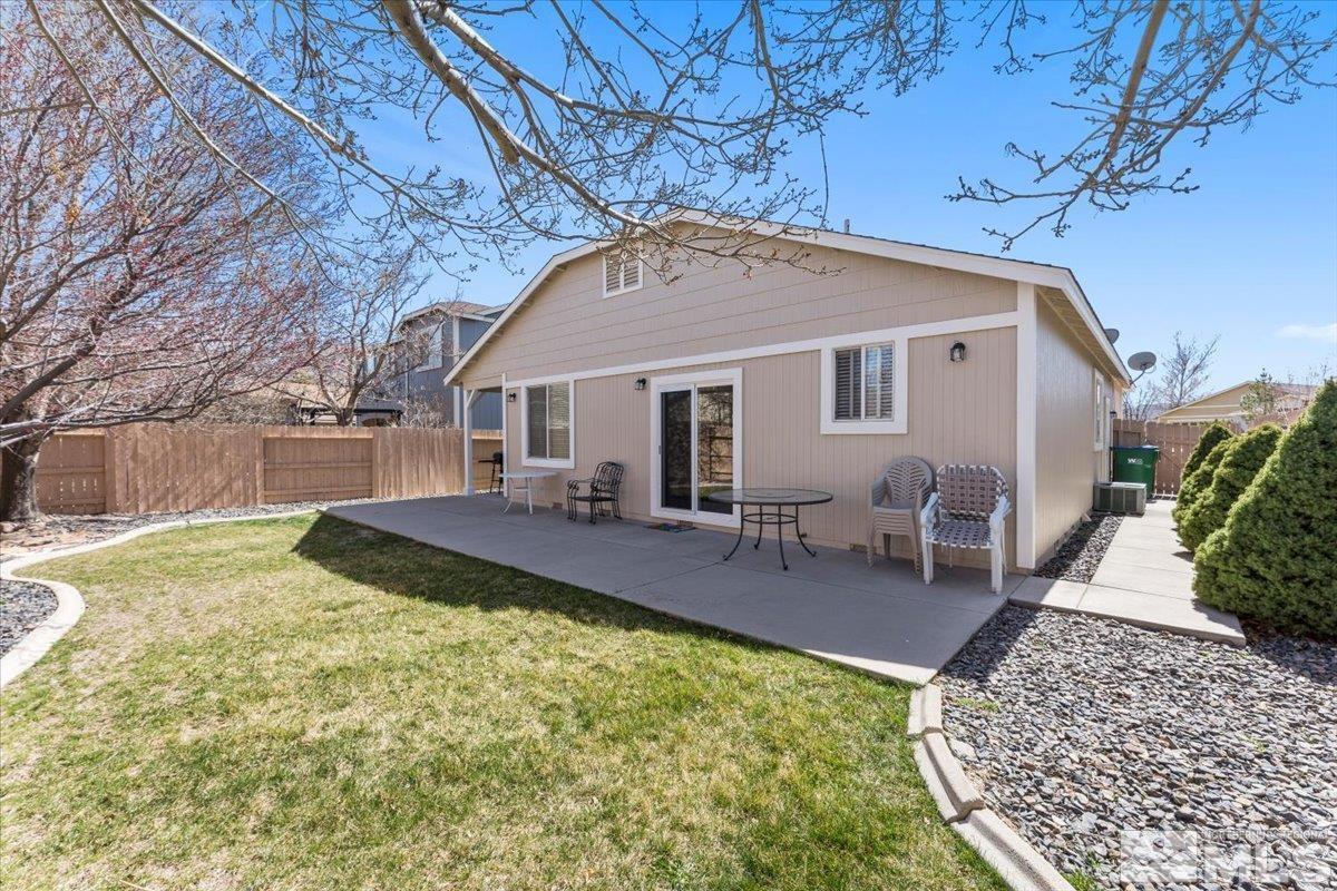 2151 Brittany Meadows Drive Reno, NV 89521 - Photo 30 of 40 a view of house with backyard and seating area
