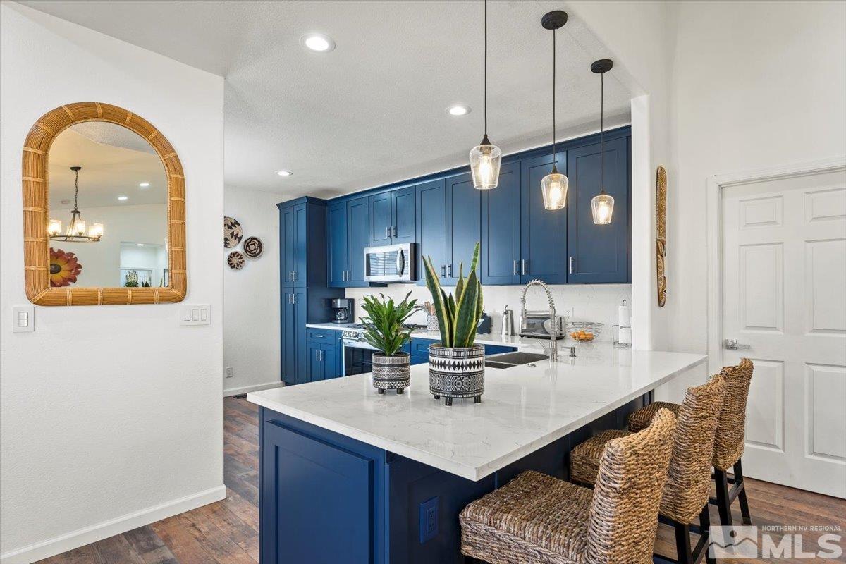 2151 Brittany Meadows Drive Reno, NV 89521 - Photo 4 of 40 a kitchen with a table and chairs in it