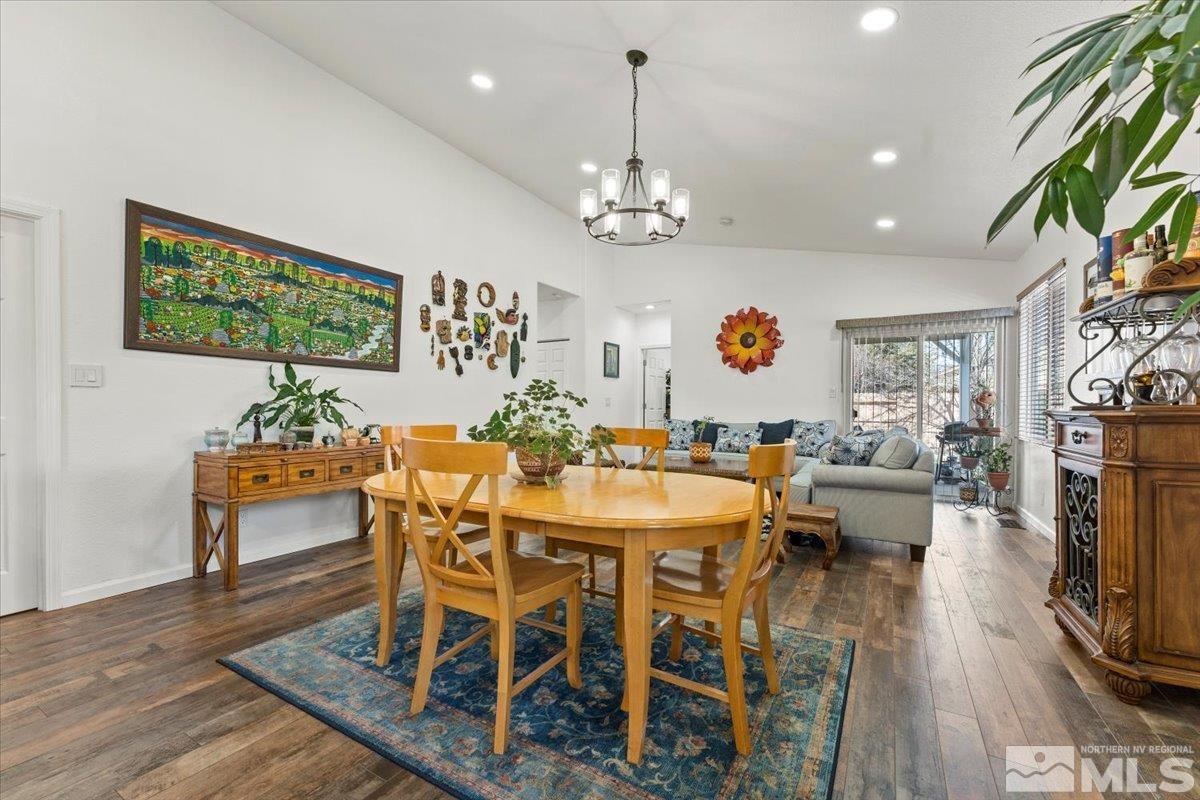 2151 Brittany Meadows Drive Reno, NV 89521 - Photo 10 of 40 a view of a dining room with furniture wooden floor and chandelier