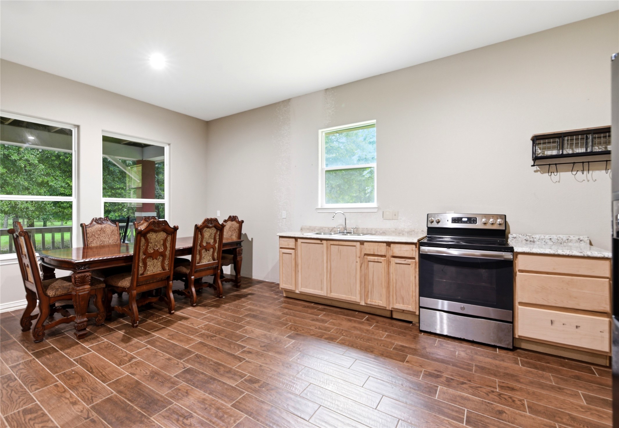 1151 County Line Road Shepherd, TX 77371 - Photo 20 of 48 Dining area, kitchen, refrigerator visible on the right.