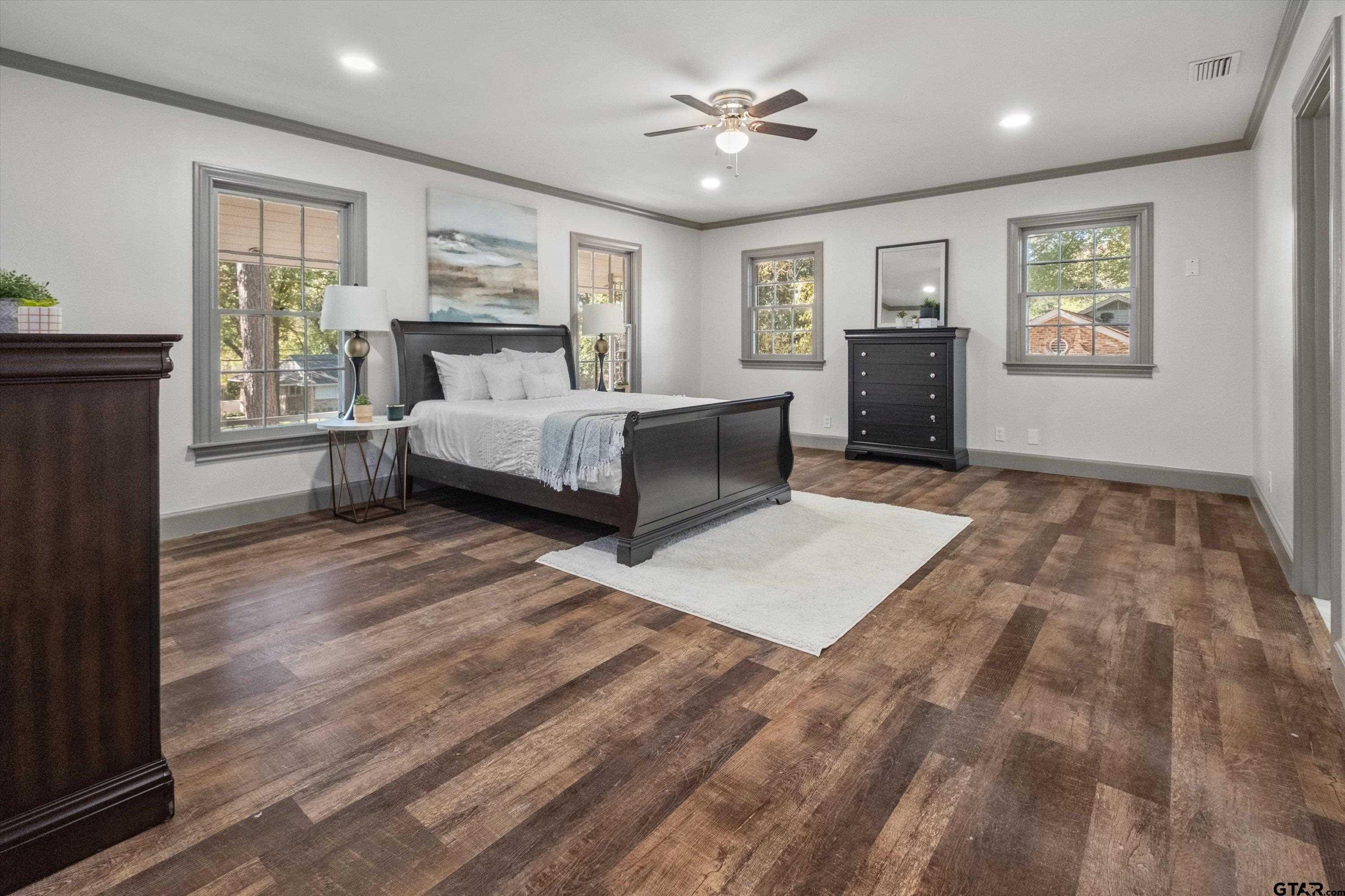 2126 McDonald Road Tyler, TX 75701 - Photo 12 of 26 a spacious bedroom with a large bed and a window