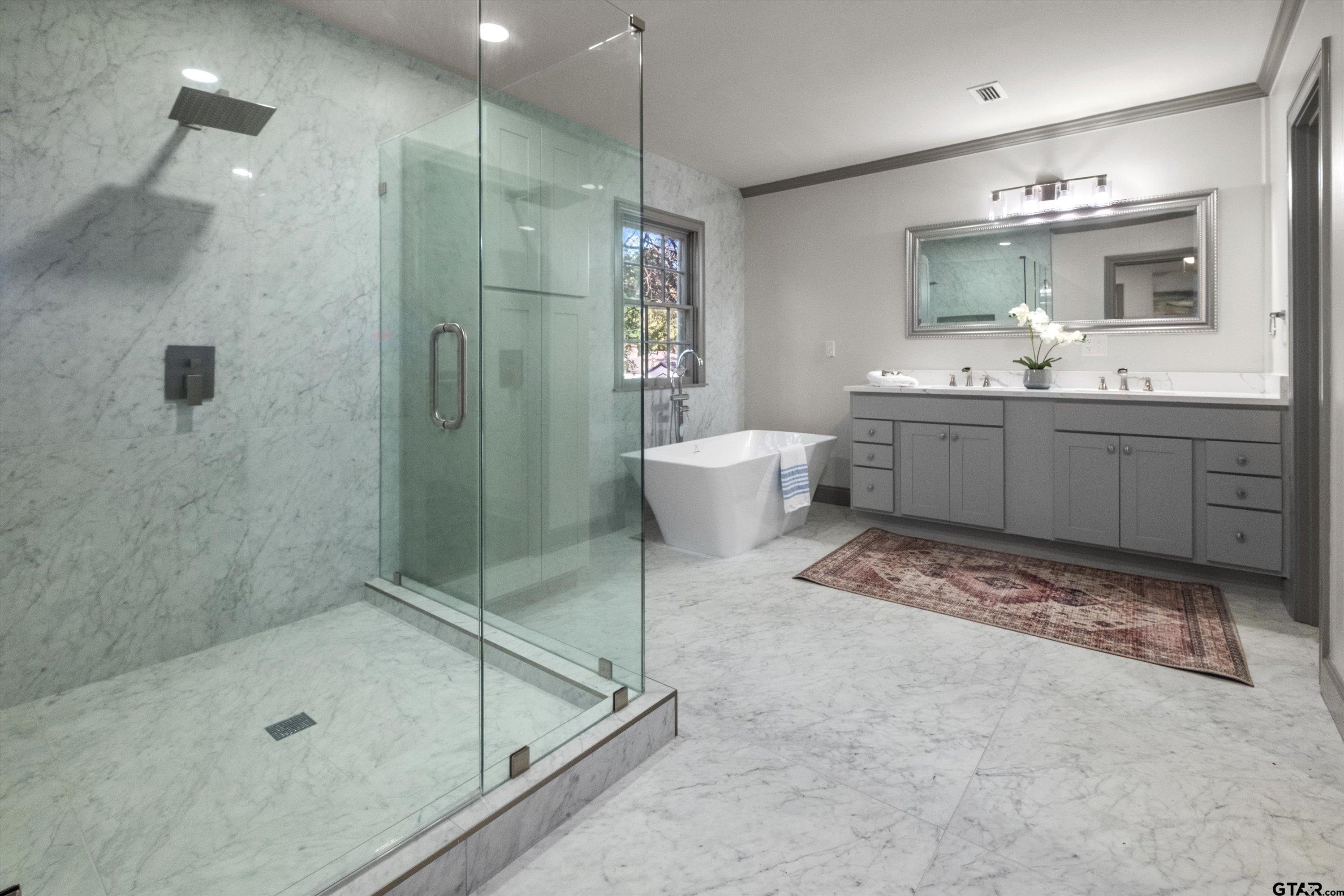 2126 McDonald Road Tyler, TX 75701 - Photo 14 of 26 a bathroom with a sink a toilet and shower