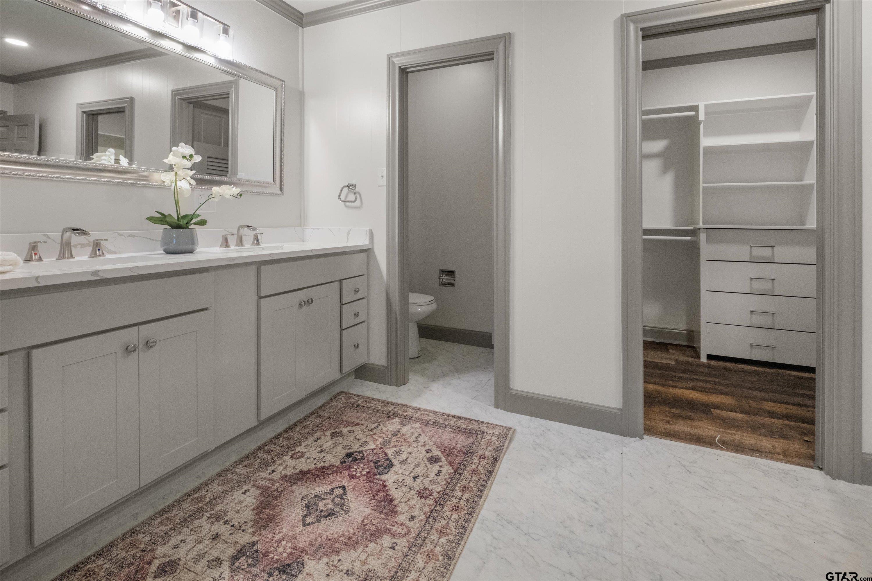2126 McDonald Road Tyler, TX 75701 - Photo 16 of 26 a spacious bathroom with a granite countertop sink and a mirror