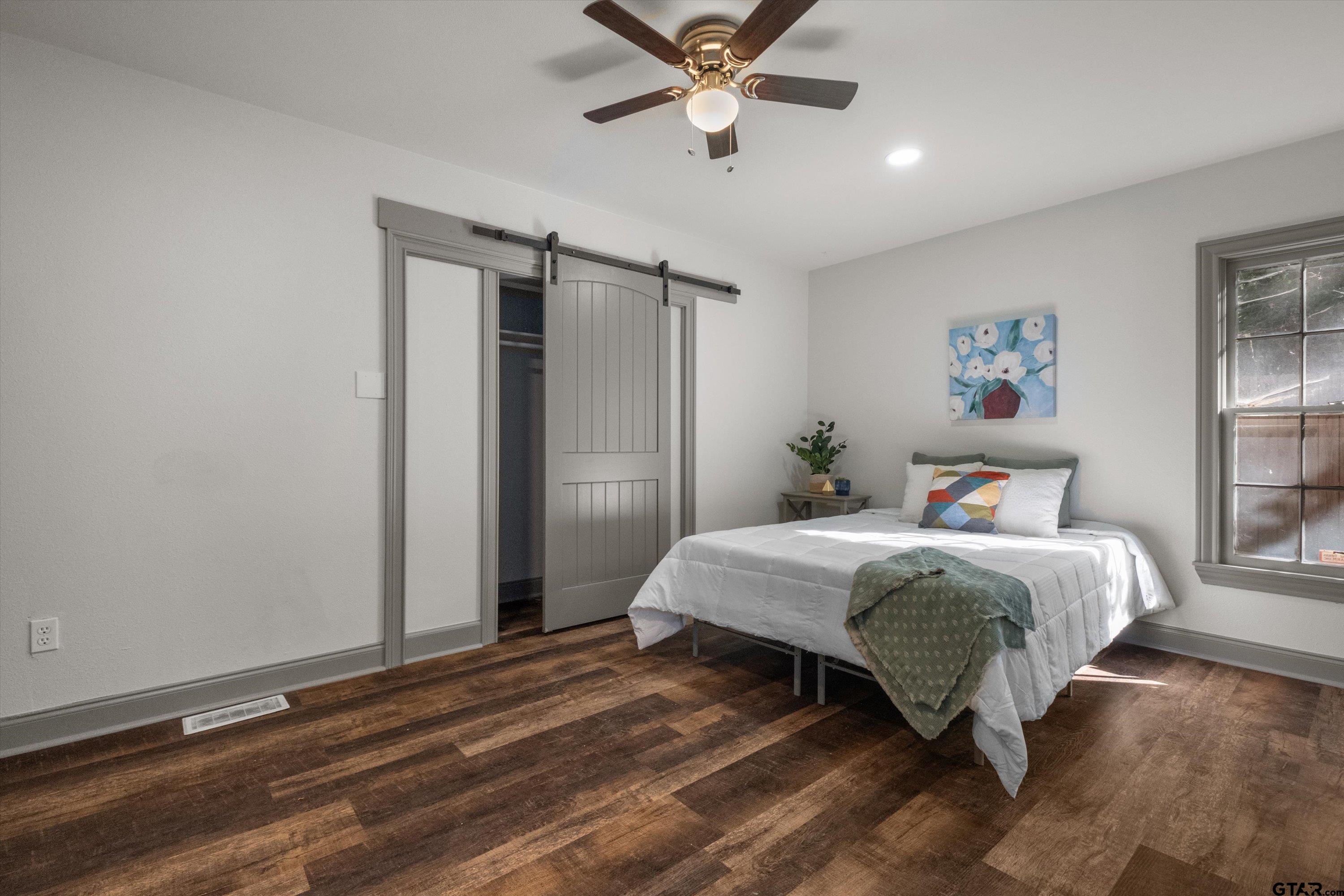 2126 McDonald Road Tyler, TX 75701 - Photo 17 of 26 a bedroom with a bed and a window