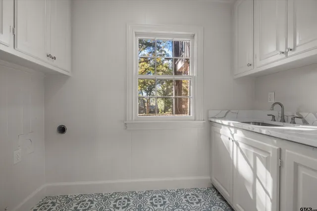 a bathroom with a sink and a window