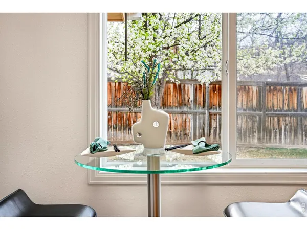 a view of living room filled with furniture and floor to ceiling window