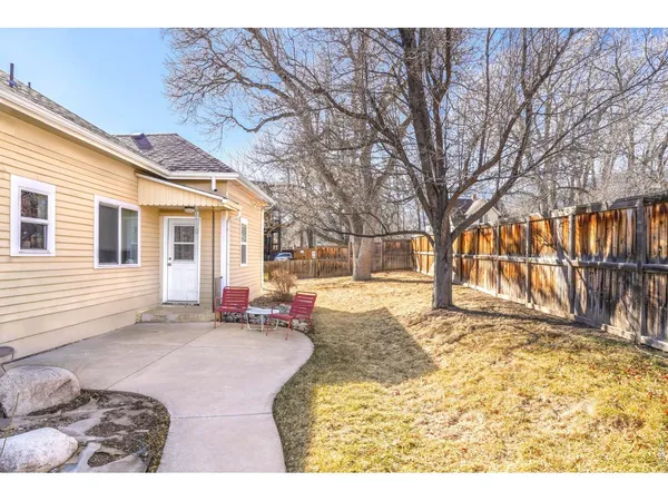 a view of a house with snow in the backyard