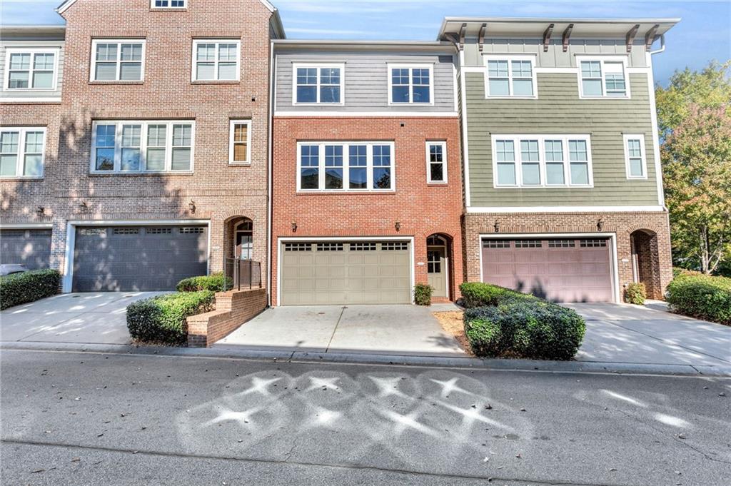 3122 Turman Circle, Unit 13 Decatur, GA 30033 - Photo 1 of 1 a front view of a building with a garden and entryway