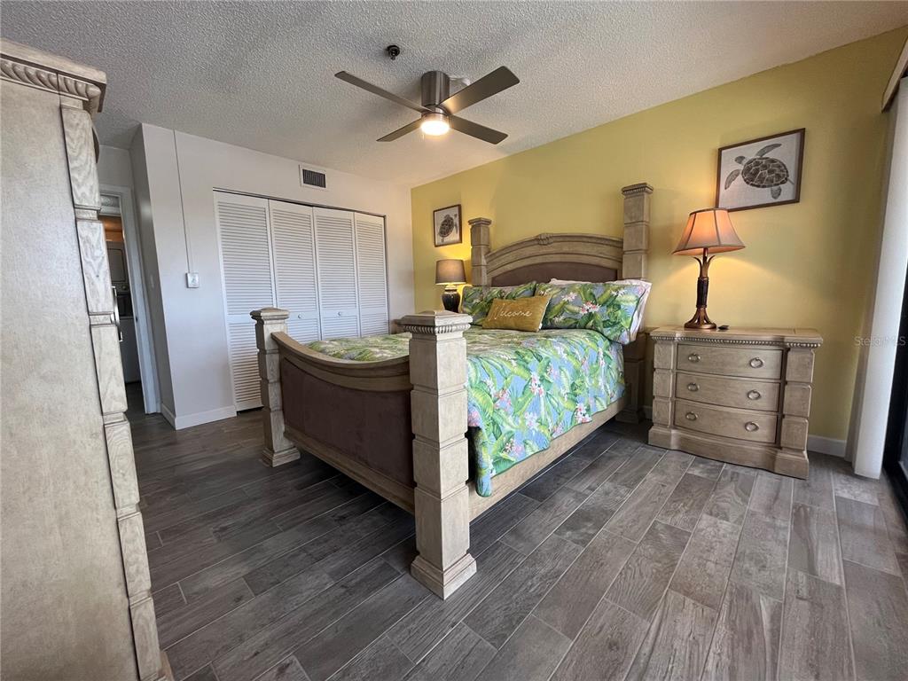 3160 Matecumbe Key Road, Unit 235 Punta Gorda, FL 33955 - Photo 6 of 15 a bedroom with a bed and a table