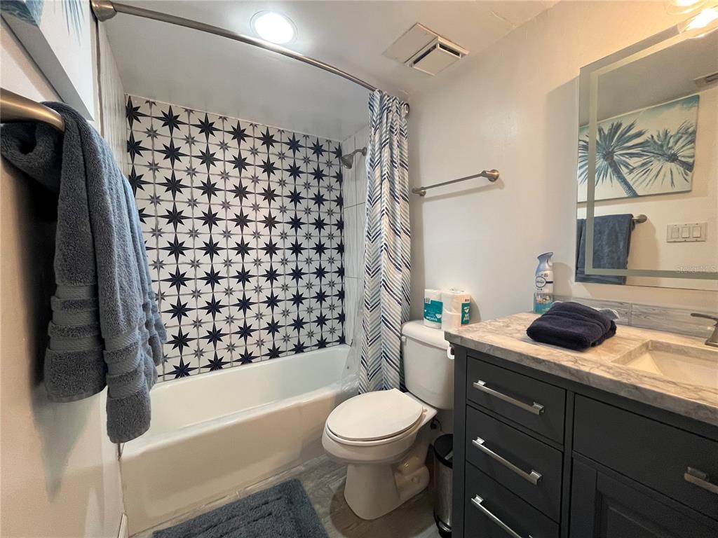 3160 Matecumbe Key Road, Unit 235 Punta Gorda, FL 33955 - Photo 8 of 15 a bathroom with a sink a toilet and shower