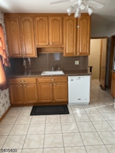72 Baldwin Place, Unit 2 Bloomfield, NJ 07003 - Photo 4 of 9 a kitchen with a cabinets and appliances