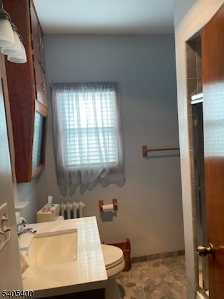 72 Baldwin Place, Unit 2 Bloomfield, NJ 07003 - Photo 9 of 9 a bathroom with a sink toilet and shower