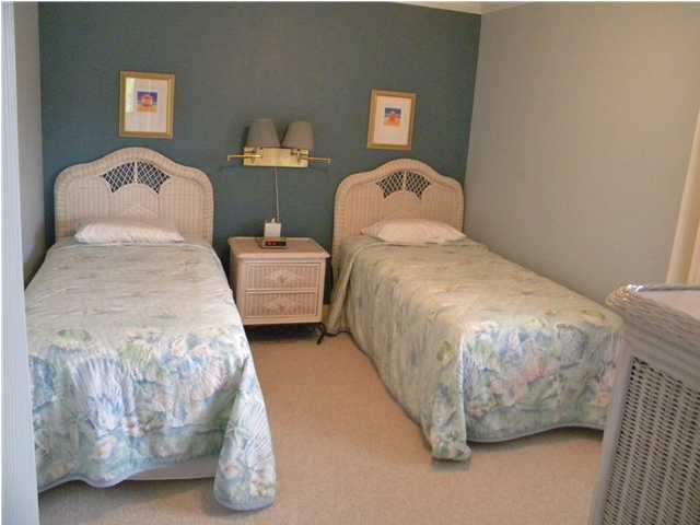 5399 Hwy Santa Rosa Beach, Unit 203 30A Santa Rosa Beach, FL 32459 - Photo 11 of 22 a bedroom with a bed and a painting on the wall