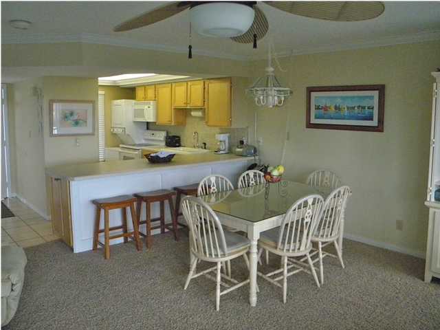 5399 Hwy Santa Rosa Beach, Unit 203 30A Santa Rosa Beach, FL 32459 - Photo 5 of 22 a view of a dining room with furniture and a window