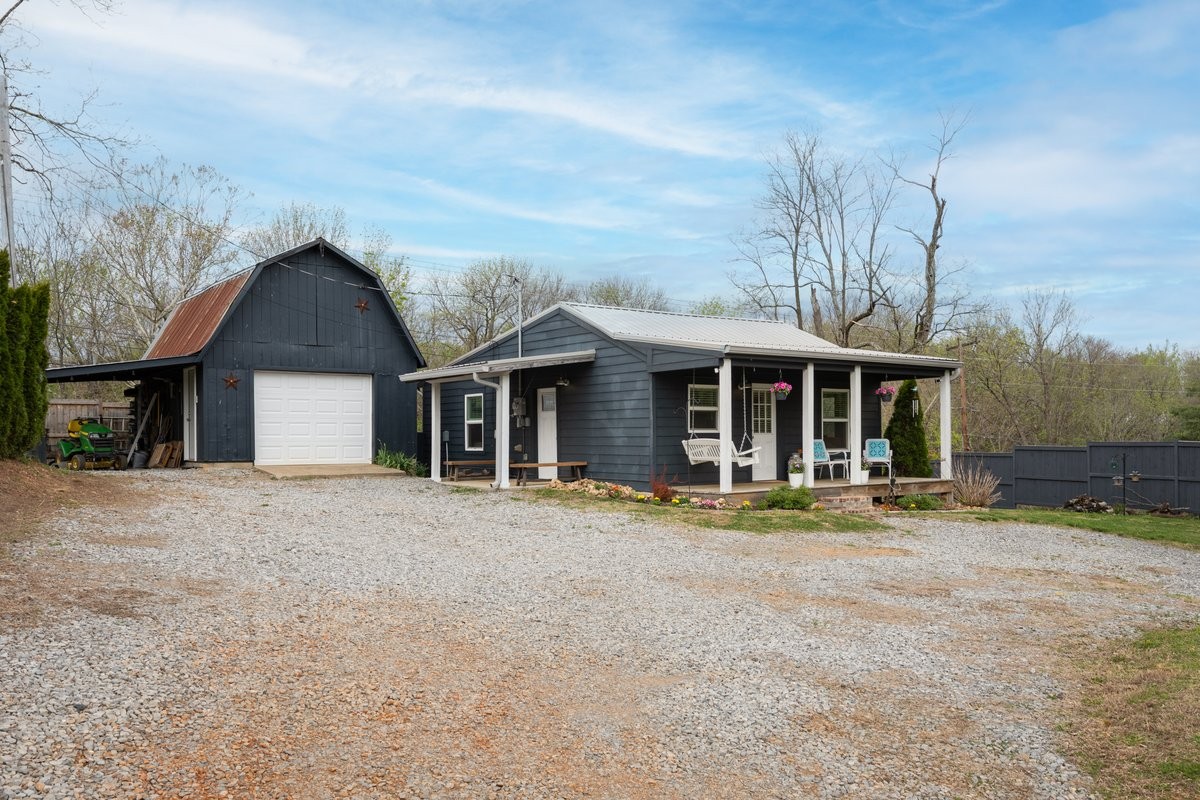 150 Crawford Hill Road Goodlettsville, TN 37072 - Photo 11 of 30 a front view of a house with a yard and garage